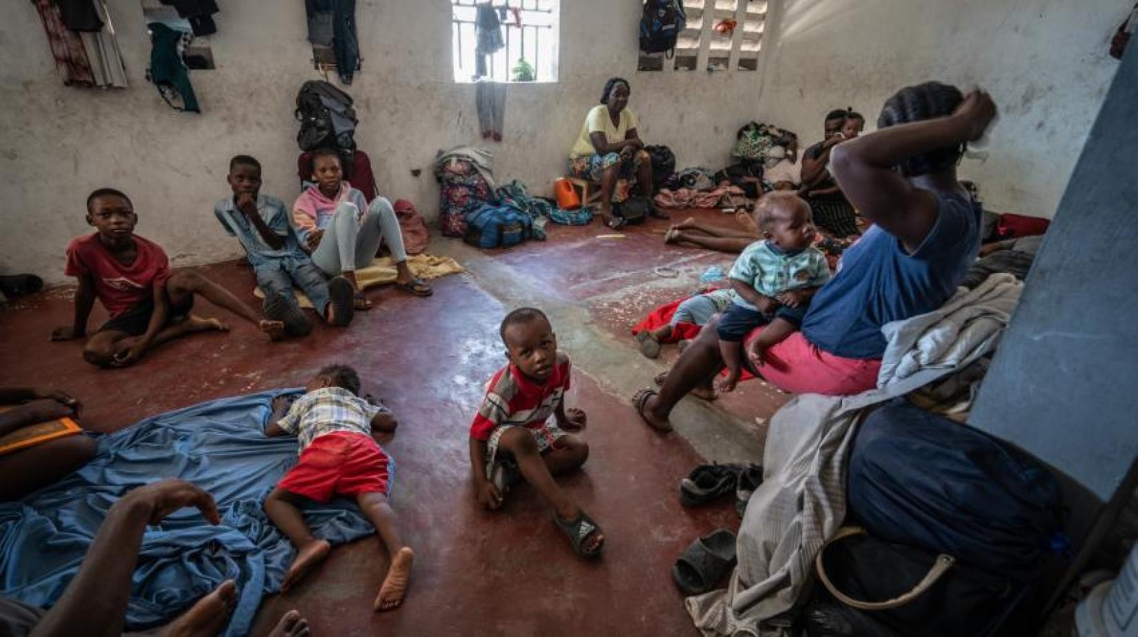 Families shelter in a boxing arena in Port-au-Prince